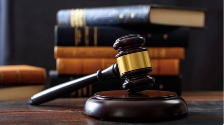Scales of justice with law books